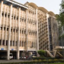 View of main building front that includes parking lot