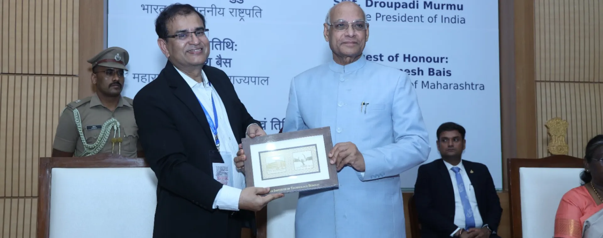 Governor of Maharashtra Ramesh Bais receiving memento