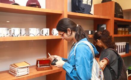 A student checking out collection of IIT Bombay merchandise at the launch of Institute’s New Souvenir Shop